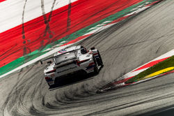 Porsche racing on the track.