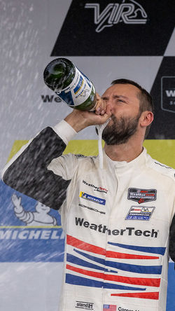 Cooper MacNeil drinking champagne.