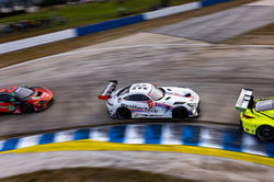 Mercedes rounding a turn from above.