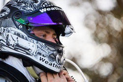 Cooper putting helmet on.