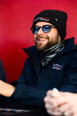 Driver at the signing table.