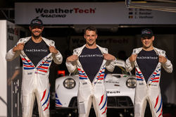 Drivers showing off team MACBAMTHOR shirts.