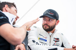 Drivers talking in the pit.