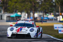 Porsche racing on track.