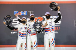 Drivers standing in victory lane.