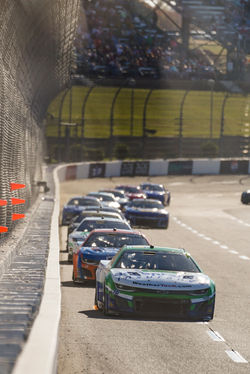 Camaro in traffic on a straight away.