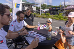 Drivers signing autographs_