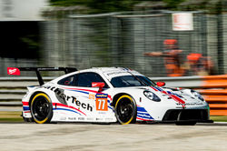 Porsche driving around the track_