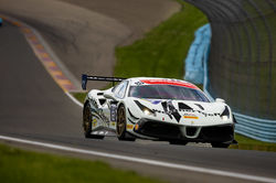 Ferrari rounding a turn.