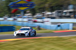Mercedes racing past the grand stand.