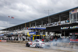Porsche peeling off pit road.