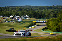 Mercedes coming up a hill.