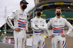 Drivers standing on the grid.