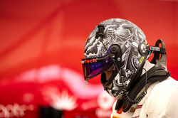 Cooper in helmet on pit road.