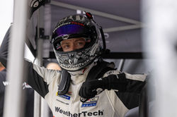 Cooper with helmet on in the pit.