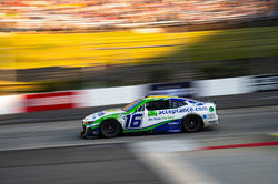 Camaro driving up a straight away.