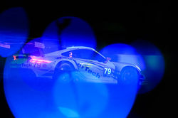 Colorful shot of the porsche on the track.