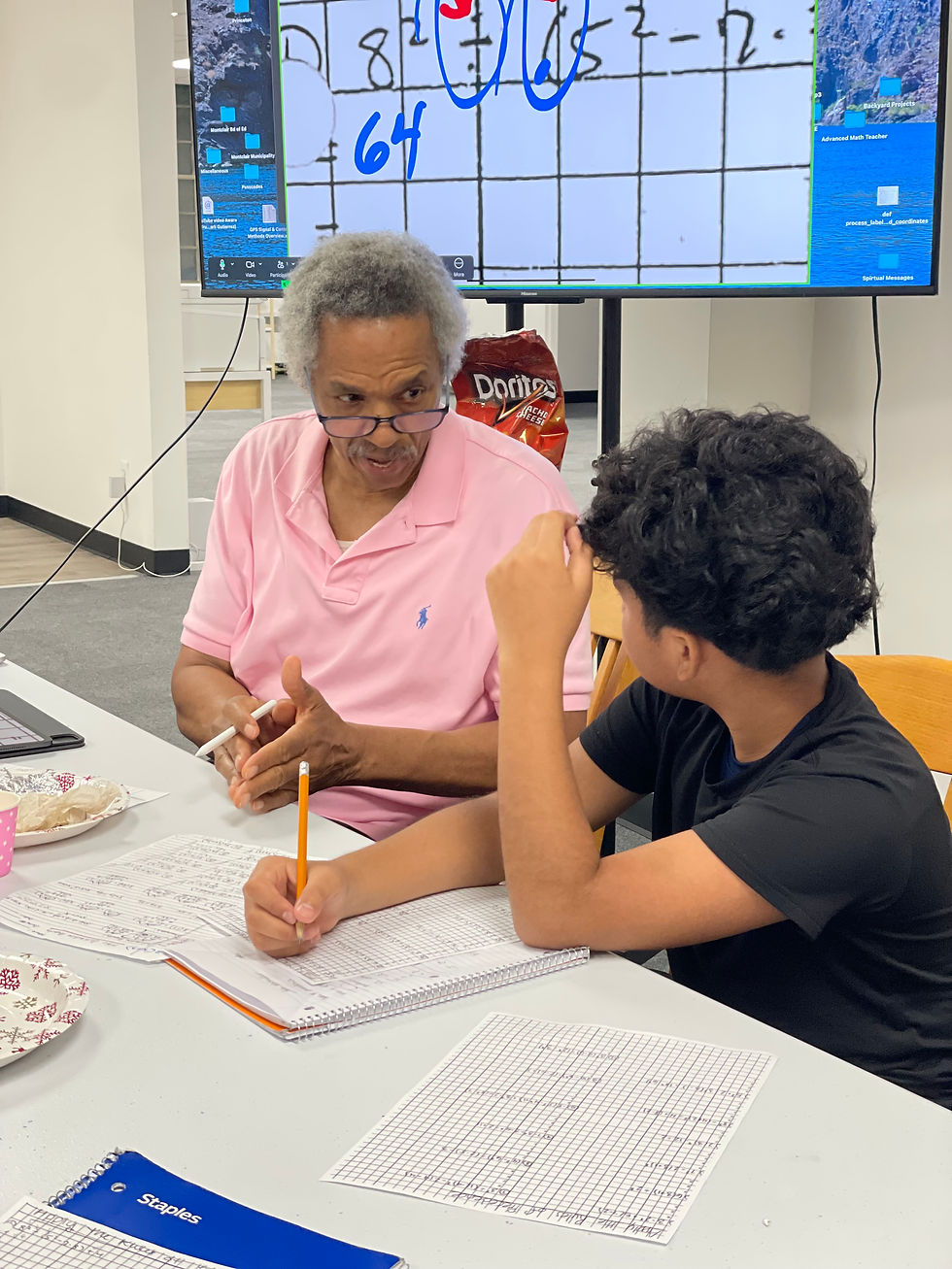 Retired MPS teacher Emmet Murphy leads MFEE's bilingual summer math intensive for teens.