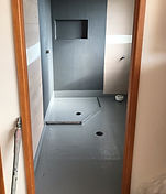 Bathroom walls and floor prepared with waterproof membrane