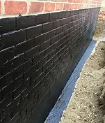 Below-ground waterproof membrane installed beside building