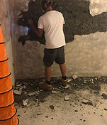 Rising damp injection treatment along brick wall
