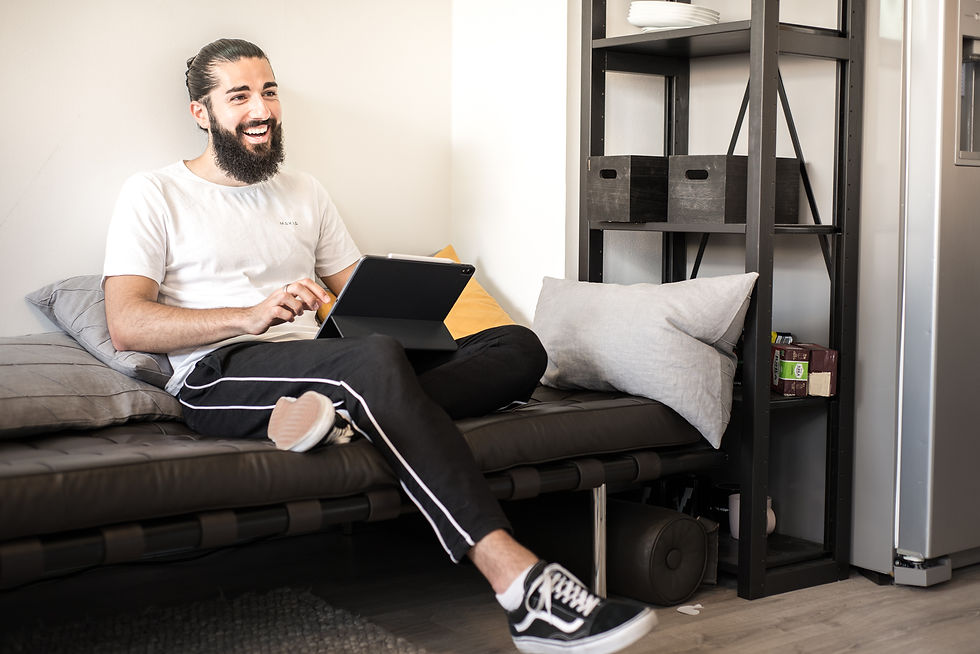Rémy Bertoli smiling and working on iPad (3).jpg