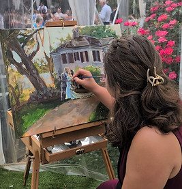 Artist live painting newlyweds and house scene