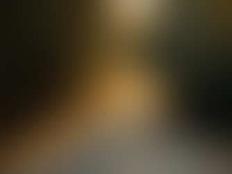 A person on an early morning jog on the side of the road, with the sunset beaming through the trees, represents how taking action fuels motivation and not the other way around.