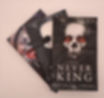 Stacked spines of dark romance books The Never King, The Dark One, and Hooked by Nikki St. Crowe and Emily McIntire