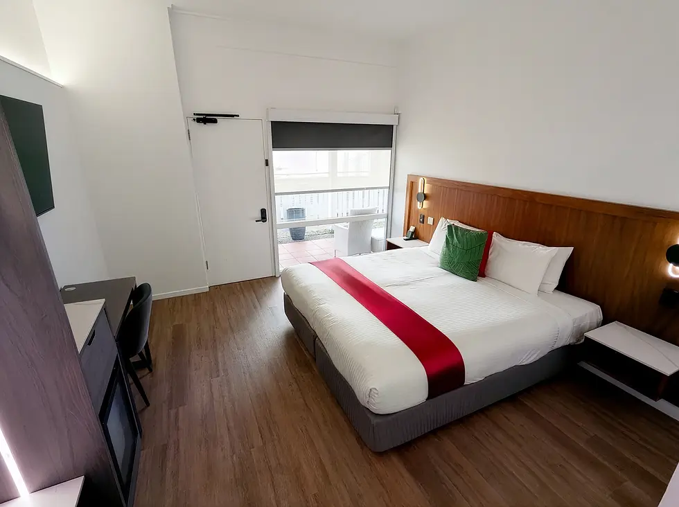 Fully renovated Tropica rooms at the Ramada by Wyndham Cairns City Centre offer blackout blinds, modern bathrooms, and contemporary fittings.