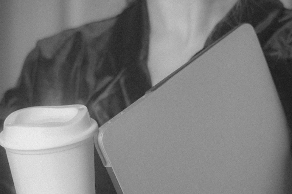 A focused professional managing a location independent lifestyle from a vibrant global workspace, illustrating the balance between travel and remote work productivity