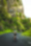 Cyclist On Winding Road