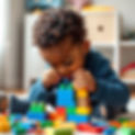 black toddler playing with building blocks.jpg