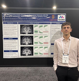 Matthew Suppa Modrusan presents his research poster titled "Automated and Interpretable Detection of Hippocampal Sclerosis (AID-HS) for Presurgical Assessment: Implementation at a District Epilepsy Centre