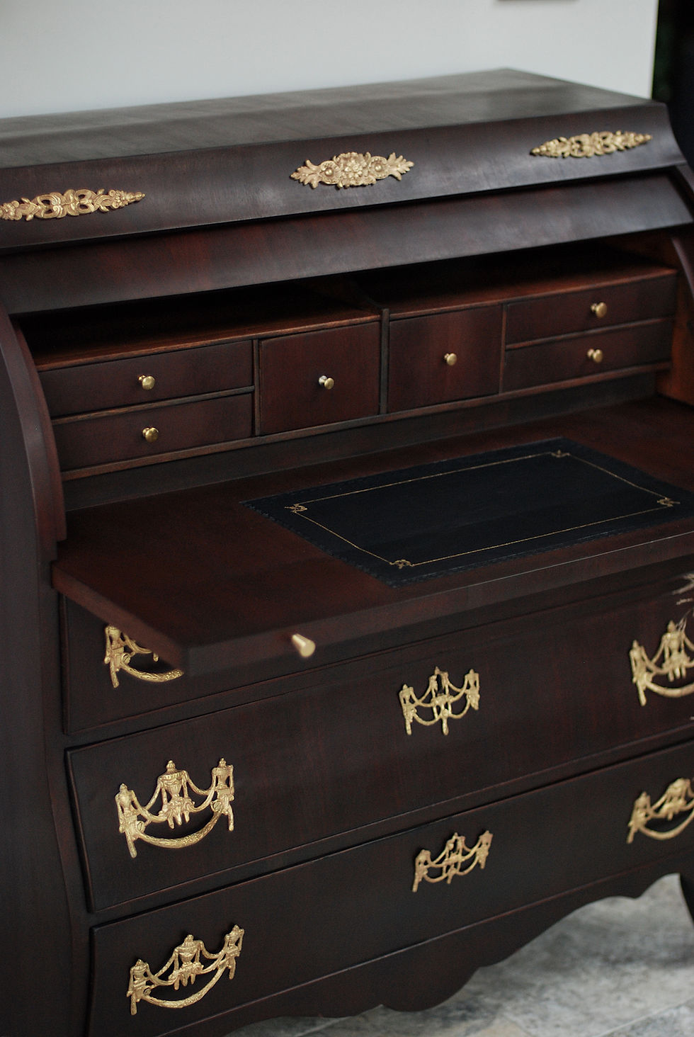 Thumbnail: Bombe style Mahogany cylinder top writing bureau with golden intricate hardware