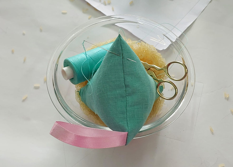 Mint colored paperweight with matching cotton and cotton scissors sitting in a rice bowl
