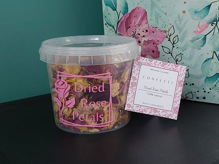 1-litre bucket of naturally dried rose petals, placed before a teal and pink floral gift box.