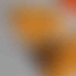 Small scissors lying on yellow felt nest to a flower made from the felt