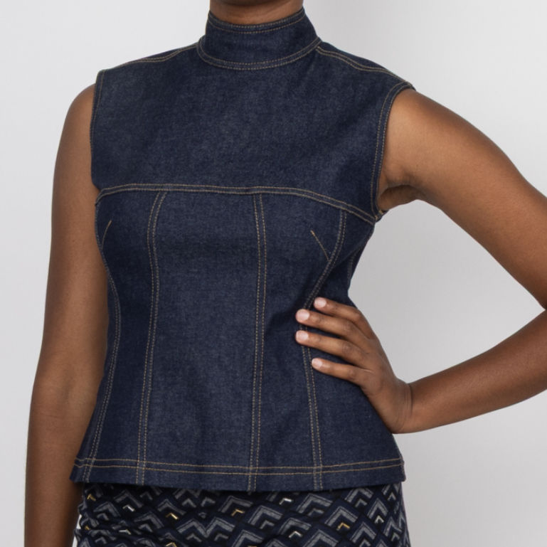 Woman wearing a classic contemporary dark denim sleeveless top