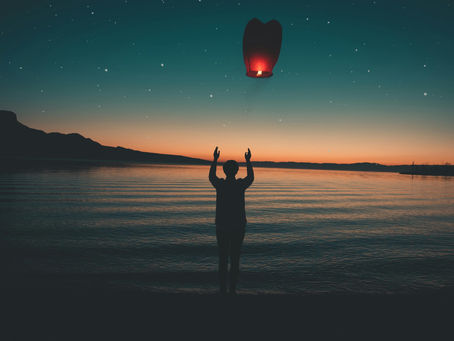 a healed person releasing a lantern symbolising their old identity