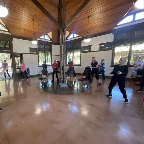 senior group fitness class with instructor at gym for active older adults