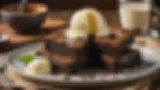 Eye-level view of a plate of cannabis brownies topped with a scoop of vanilla ice cream