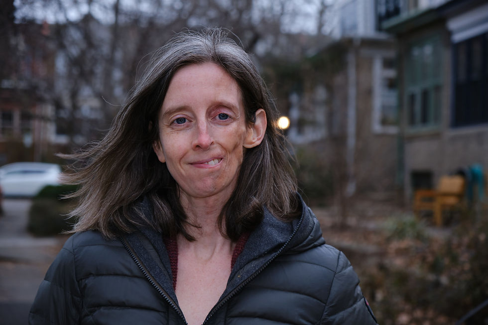 Monica Fauble, Licensed Acupuncturist, Philadelphia, PA on a windy winter-spring day, hair blowing