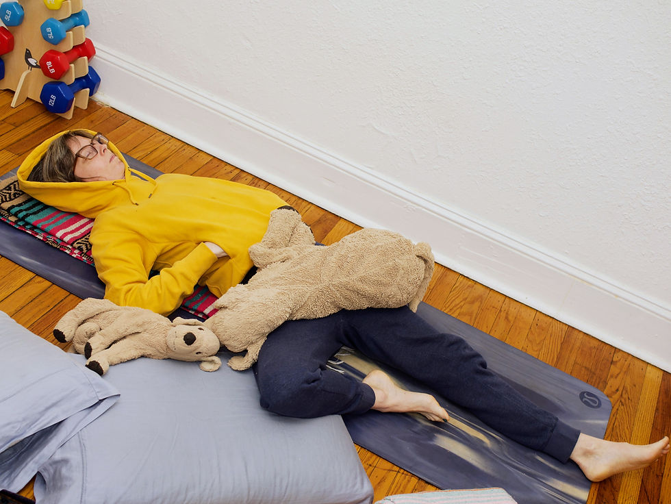 Monica Fauble resting on the ground on blankets