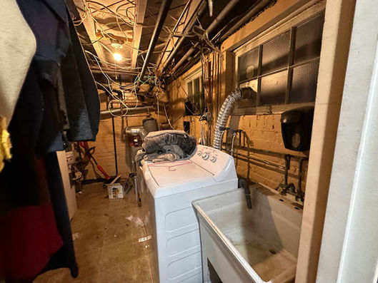 Utility room demolition showcasing structural preparation during a complete Washington, DC home renovation