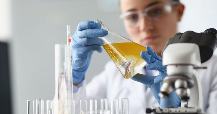 Chemist Analysing Oil inLaboratory.jpg