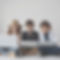 a group of 3 children of both genders learning on laptops, one wearing a detective hat, on
