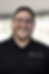 Smiling professional in PHI-TECH attire.png