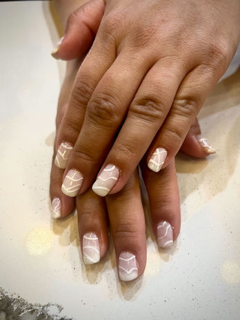 Estemio non toxic gel application with a milky white base and nail art