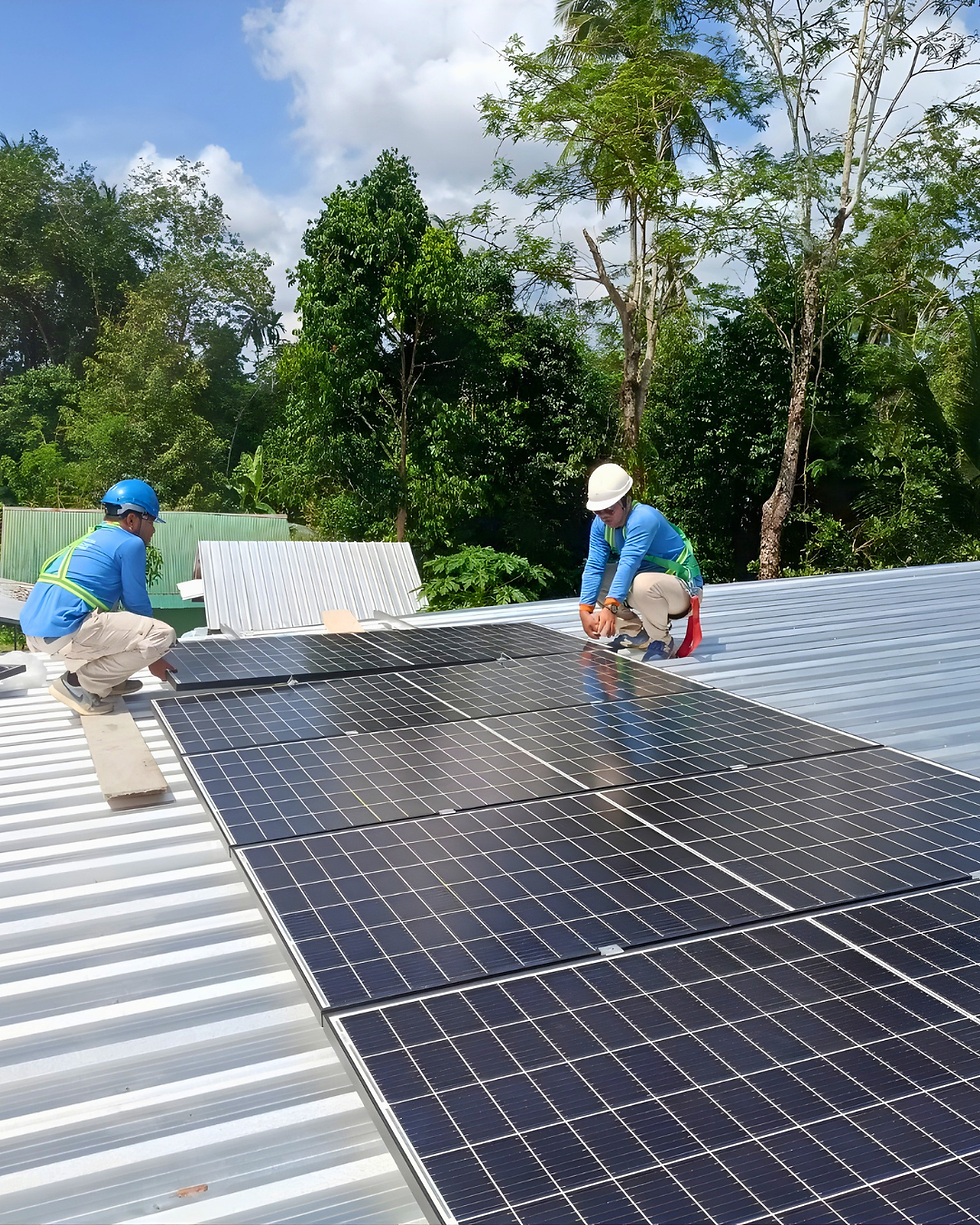 TAE Solar technicians installing solar panels on a roof